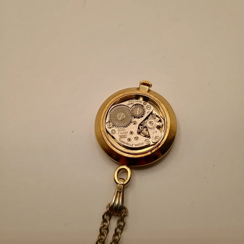 Caravelle Gold Toned Pendant Wind Up Watch
